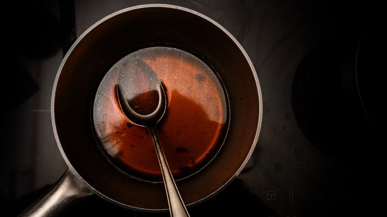 Sauce pan with reduction and spoon