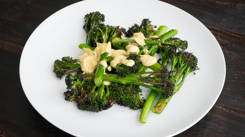 Tahini dressing on roasted broccolini