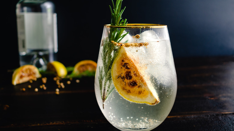 Gin and tonic with charred lemon and rosemary