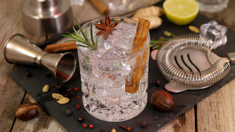 Cocktail with cinnamon, rosemary, and star anise