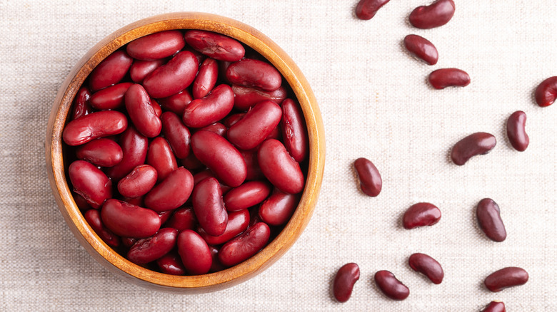 Dried red kidney beans in wooden bowl