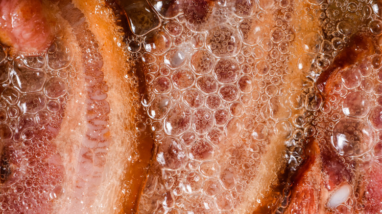 Close-up of frying bacon