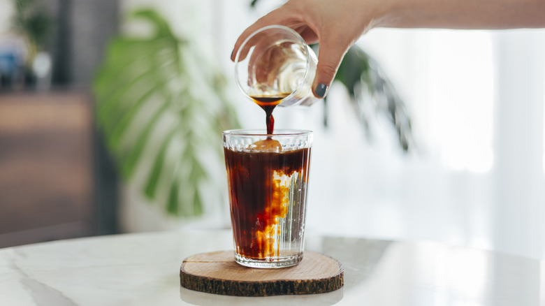 Coffee pouring in glass 