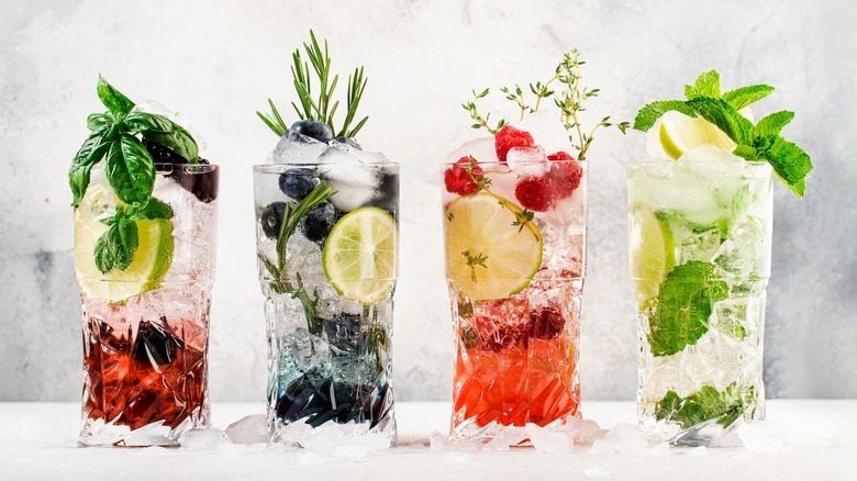 Cocktail glasses with fresh herbs