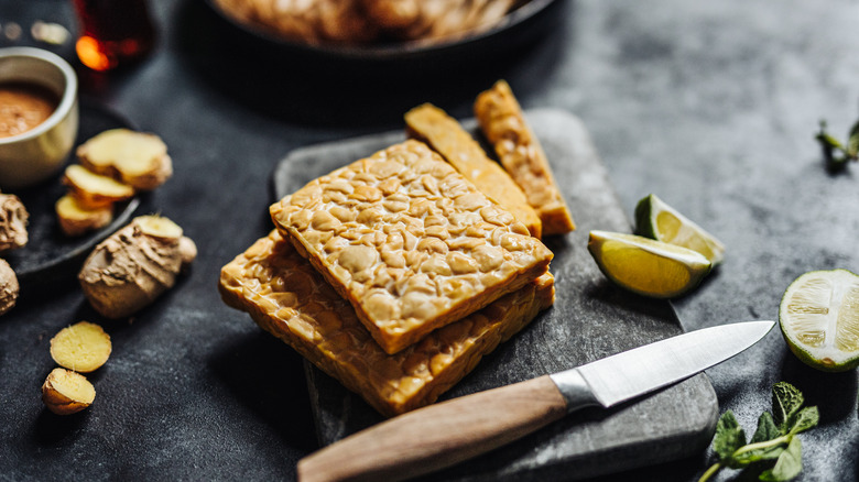 tempeh slices on wooden board