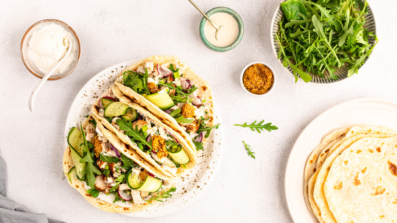 View of tacos with arugula on a plate