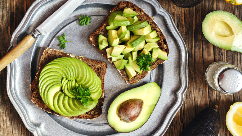 Avocado toast on silver serving tray
