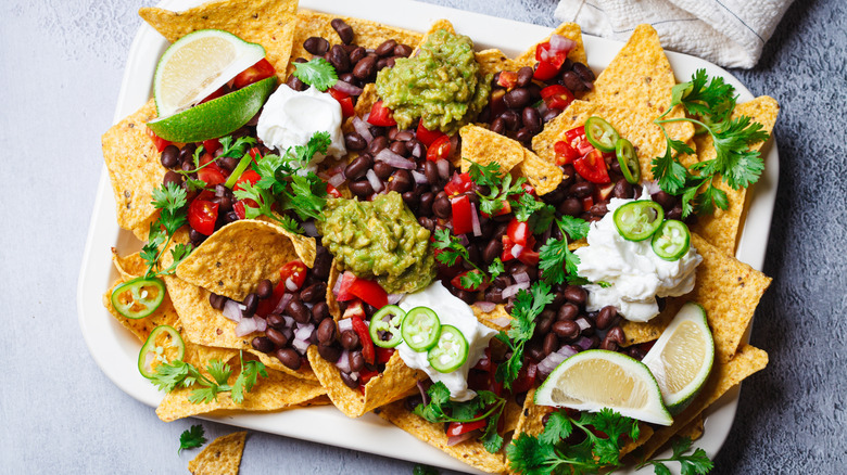 Loaded avocados with toppings on a plate