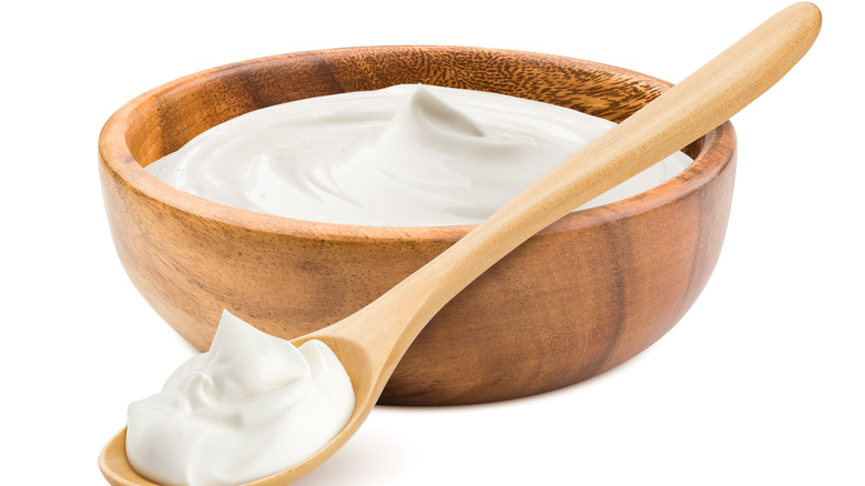 Cream cheese in wooden bowl