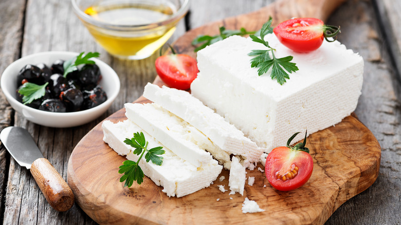 Feta cheese on wooden board