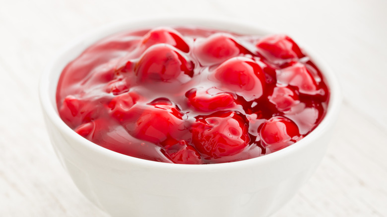 Canned cherry pie filling in white bowl