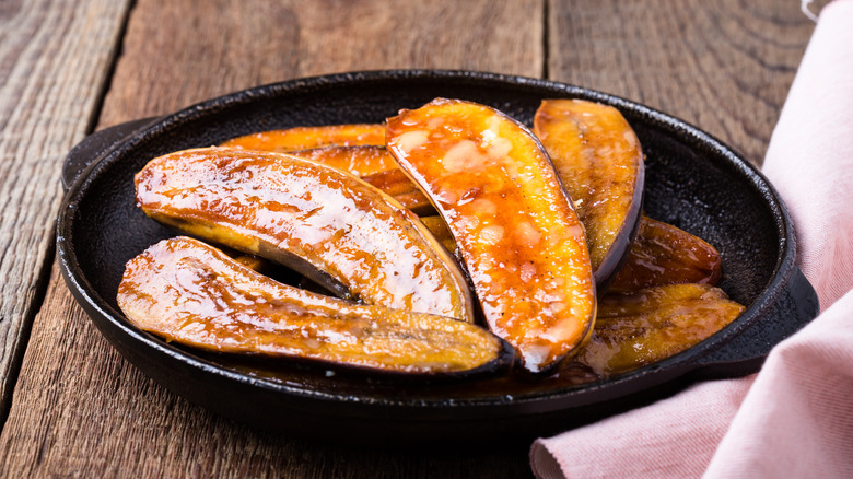 slices of caramelized bananas in pan