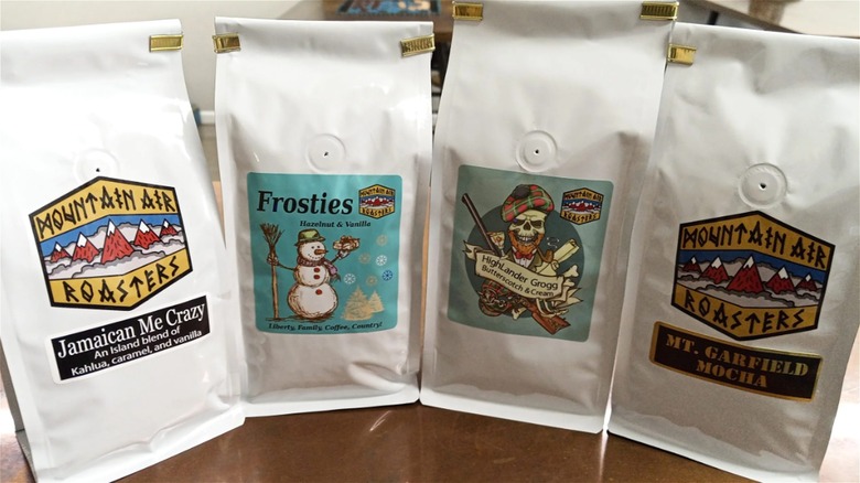 four white coffee bags