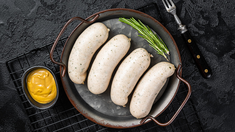 White sausages in pan