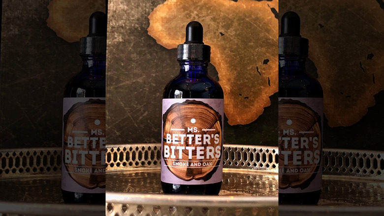 bottle of Ms. Better's Smoke and Oak bitters on tray