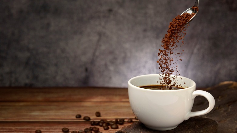 Instant coffee pouring into cup