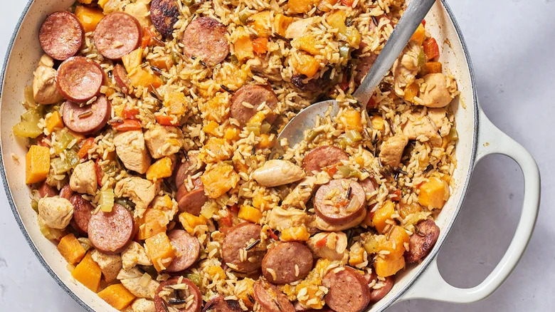 Pot of jambalaya with serving spoon