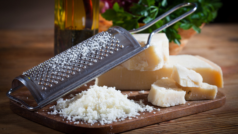 Parmesan cheese with grater