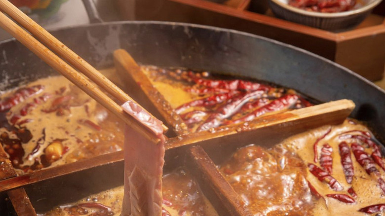 meat in hotpot soup with dividers