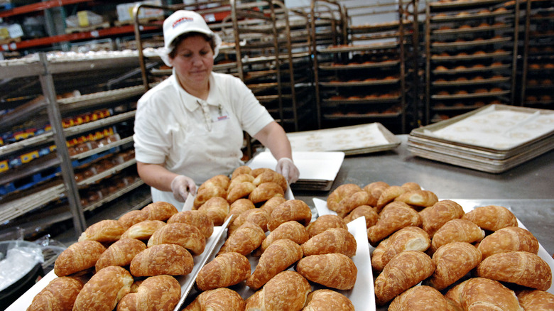 Costco employee moving bakery goods