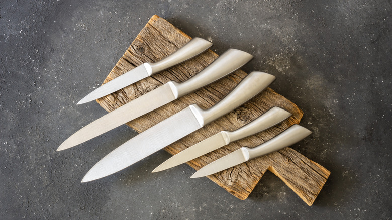 Knives on a cutting board.