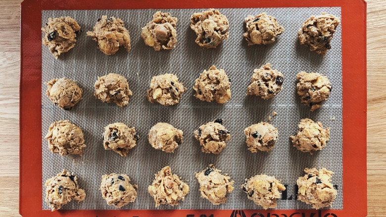 Balls of cookie dough on a silpat.