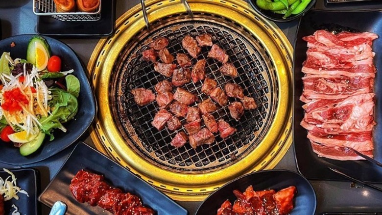 charcoal grill with meat cubes