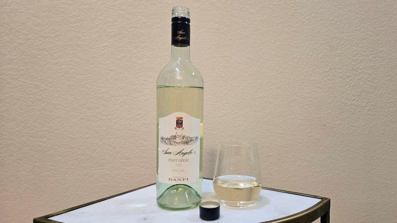 Bottle of Banfi pinot grigio with a wine glass on a table