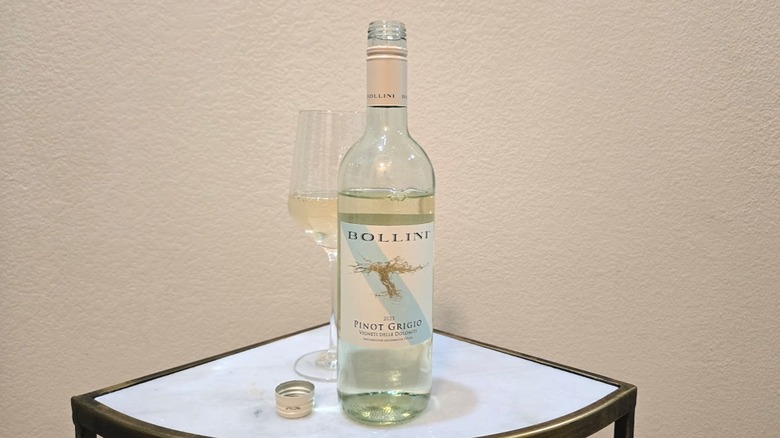 Bollini pinot grigio bottle and a wine glass on a table