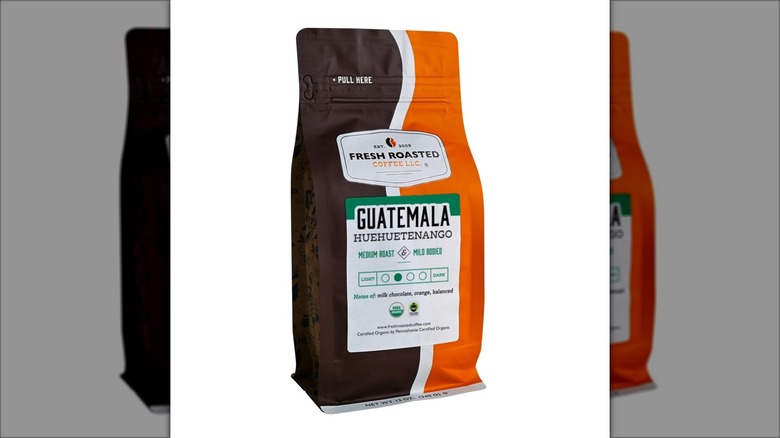 Bag of Fresh Roasted Coffee Guatemala Huehuetenango on white background