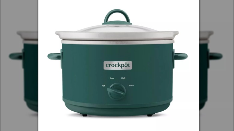 matte green Crock-Pot with white ceramic insert on white background