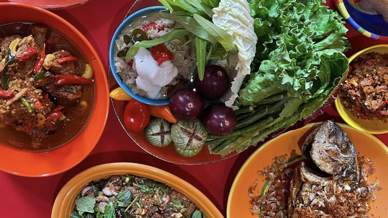 table of thai dishes with fish