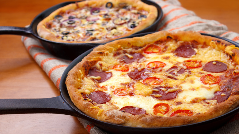 Pizzas in frying pans