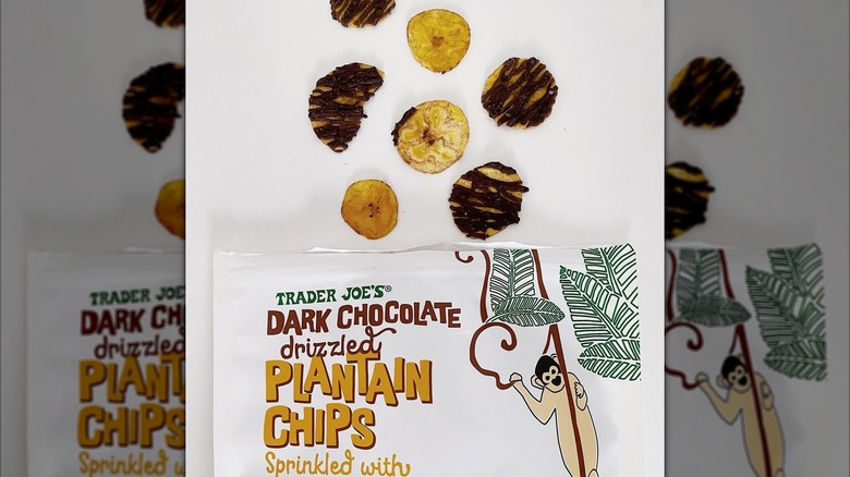 Bag of chocolate covered plantain chips with some chips displayed on counter