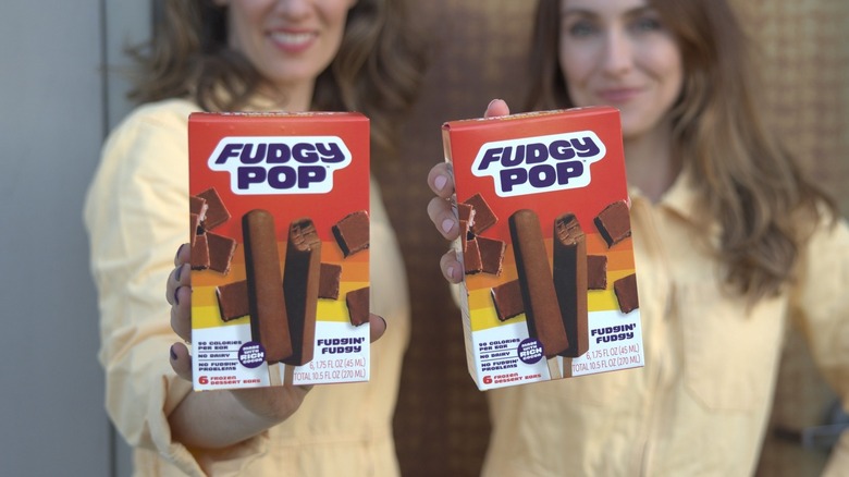 Women holding Fudgy pop packages