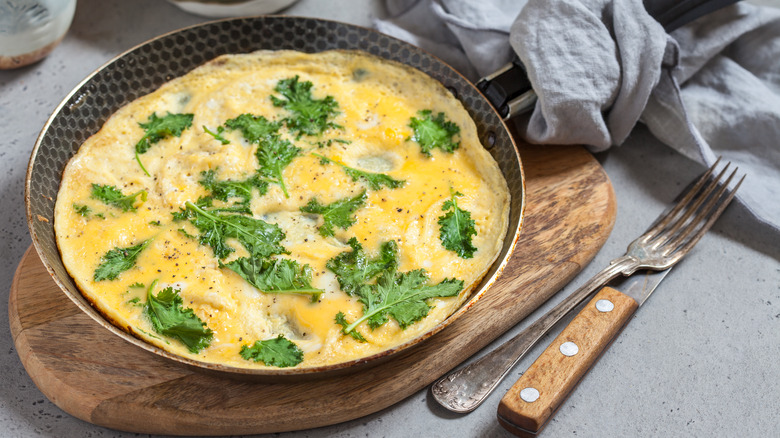 omelet with baby kale leaves