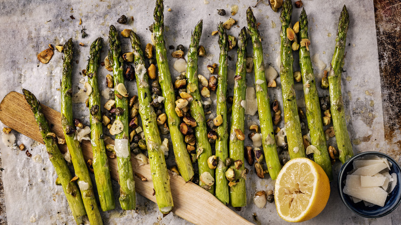 Aerial shot of roasted asparagus on cutting board