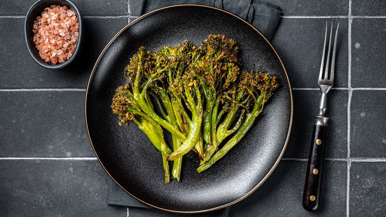 Aerial shot of roasted broccolini on plate