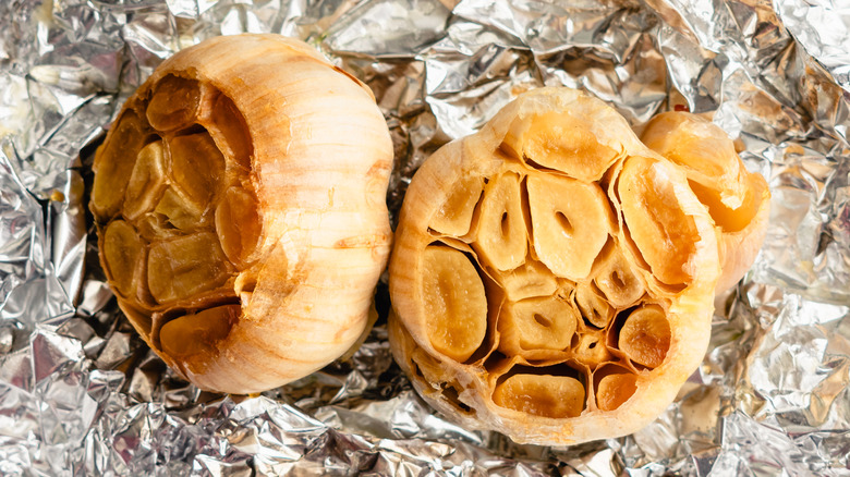 Aerial shot of roasted garlic on foil