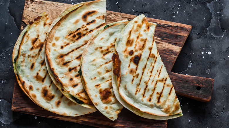 Quesadillas on wooden board 