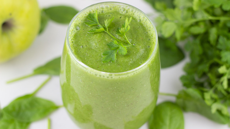 Green smoothie garnished with parsley 