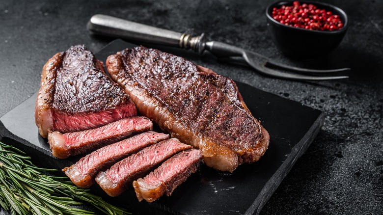 Steak rests on a cutting board