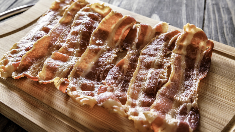 bacon on wooden cutting board