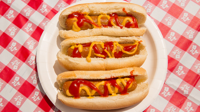 Three hot dogs on a plate