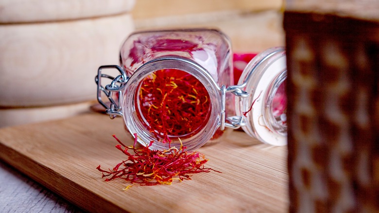 Saffron pouring out of jar