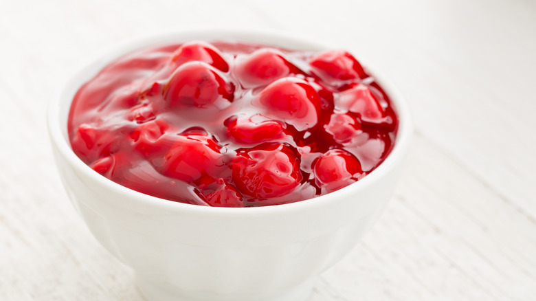 Canned cherry pie filling in white bowl