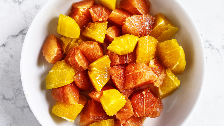 Grapefruit pieces in white bowl