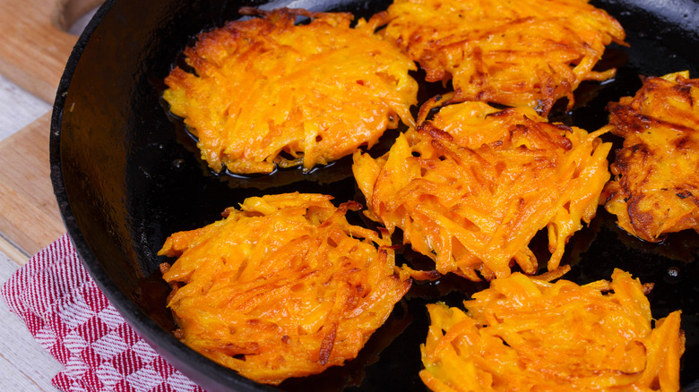 Carrot latkes in pan