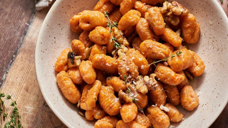 Carrot gnocchi in bowl