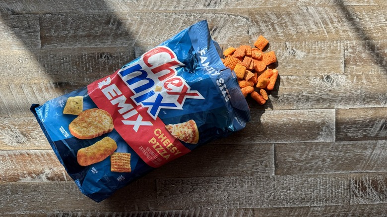 Cheesy pizza Chex Mix opened on table